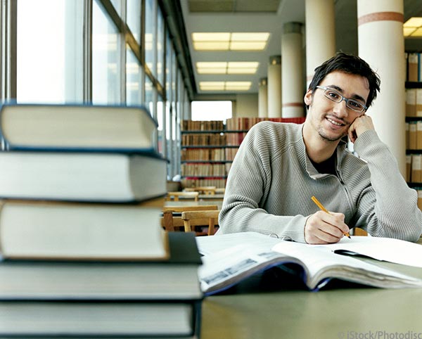 student in library