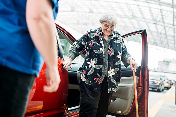 senior getting out of Lyft