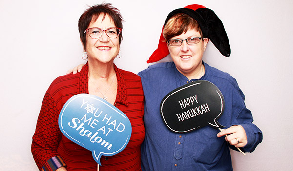 Attendees get their photo snapped in the JFCS photo booth at the Shomrei Torah community event, ReJEWvenate, in Santa Rosa.