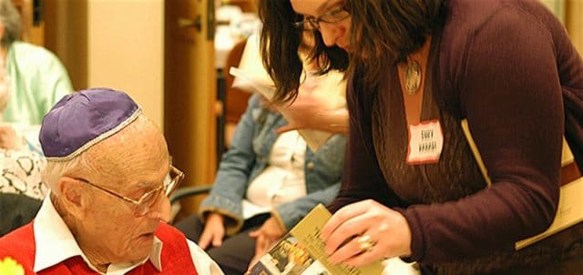 Holocaust survivor with volunteer