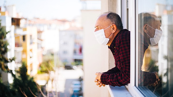 senior looking at window