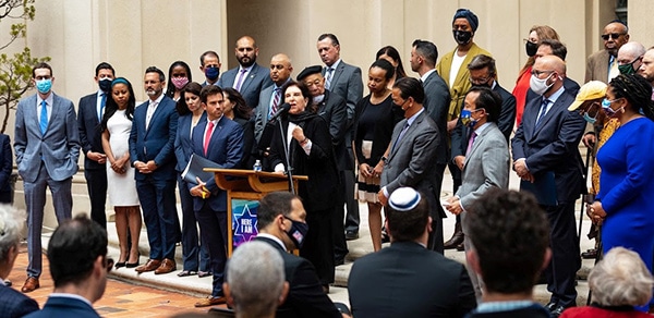 Dr. Anita Friedman, JFCS Executive Director, addresses San Francisco Mayor London Breed, State Attorney General Rob Bonta, and other elected officials and community leaders on the urgent fight against prejudice.