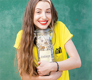 young woman holding college savings