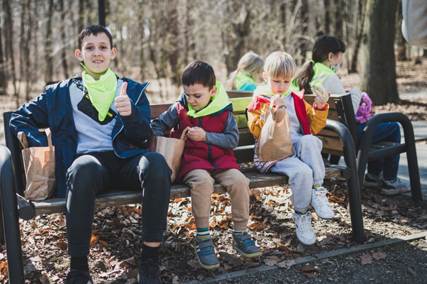 On a recent outing to the park in Kraków, refugee children enjoyed a picnic lunch—a reminder of life in better times. 