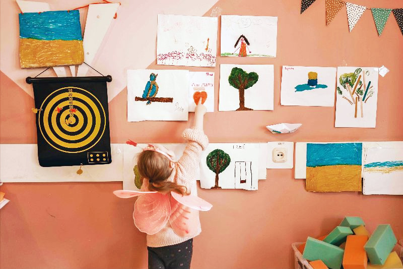 A young Ukrainian girl proudly shows off the artwork she created. All photos courtesy of Maxim Chumash/IsraAID.