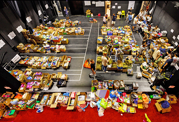 Pounds of food are distributed to children, families, and the elderly.