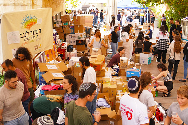 Israelis arrive for food, clothing, and medical attention.