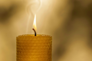 lit beeswax candle