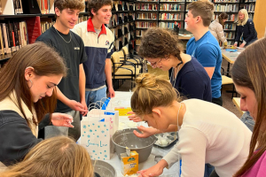 Teen volunteers making food for the hungry