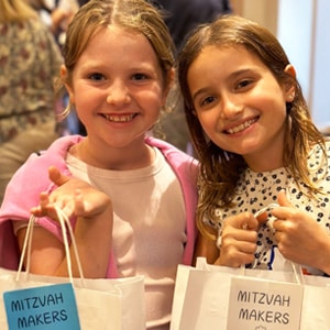 two young mitzvah makers