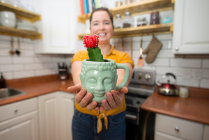 person showing a plant